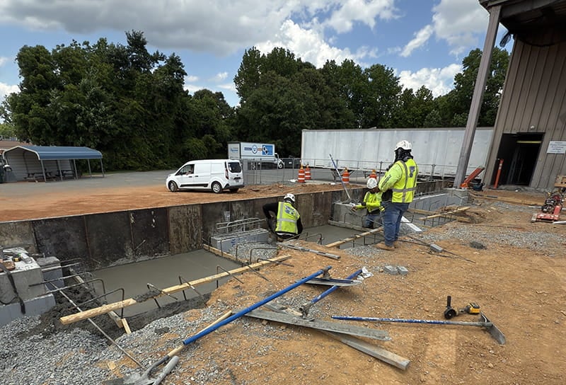 Construction workers building the new docks for Nordfab's XD plan expansion in May 2025
