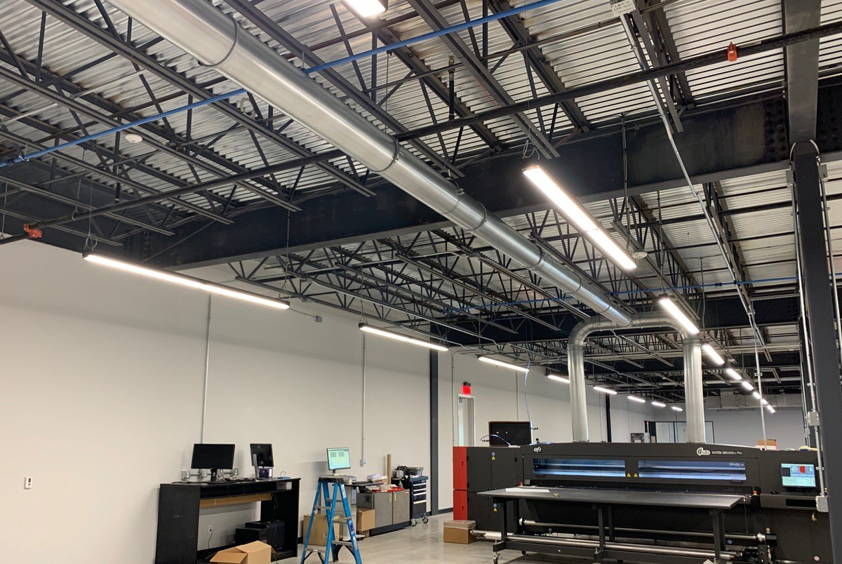 Nordfab® QF dust collectionducting installed on equipment at The Trade Group facility
