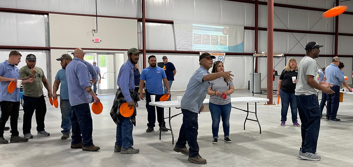 Nordfab employees throwing frisbees