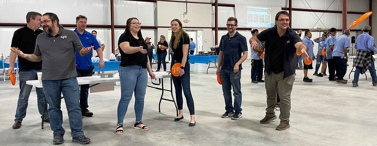 Nordfab employees throwing frisbees