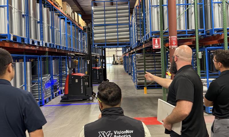 Pointing out robot forklifts in action