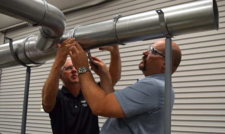 Nordfab University attendees assembling Quick-Fit ducting